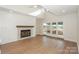 Spacious living room featuring hardwood floors, a fireplace, and glass doors leading to the outdoors at 633 Portside Dr, Davidson, NC 28036