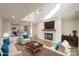 Open concept living room features a fireplace, television, hardwood floors, and kitchen at 633 Portside Dr, Davidson, NC 28036