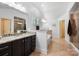 Large bathroom featuring dual vanities, a soaking tub, and a glass shower at 7327 Snowbird Ct, Mint Hill, NC 28227