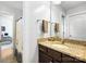 Bathroom with granite countertop, updated fixtures, and combination shower and tub at 7327 Snowbird Ct, Mint Hill, NC 28227