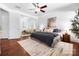 Open bedroom showcasing an area for seating, and hardwood floors throughout the space at 7327 Snowbird Ct, Mint Hill, NC 28227