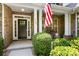 Inviting front porch with a patriotic display, stylish door, and well-maintained landscaping at 7327 Snowbird Ct, Mint Hill, NC 28227