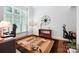 Bright home office with natural light, neutral walls, and a modern desk at 7327 Snowbird Ct, Mint Hill, NC 28227