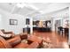 Spacious open-concept living room with wood floors flowing into the kitchen and dining area at 7327 Snowbird Ct, Mint Hill, NC 28227
