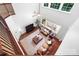 Bright living room with two story vaulted ceiling, ceiling fan, and large windows at 7327 Snowbird Ct, Mint Hill, NC 28227