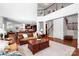 Spacious open-concept living room featuring hardwood floors and staircase at 7327 Snowbird Ct, Mint Hill, NC 28227