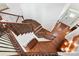 Staircase showcasing the open design, hardwood floors, and natural light at 7327 Snowbird Ct, Mint Hill, NC 28227