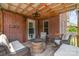Backyard deck with stone fireplace and comfortable outdoor seating area at 773 Hathcock Glen Dr, Oakboro, NC 28129