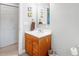 Bathroom featuring a sink vanity, toilet, and mirror at 773 Hathcock Glen Dr, Oakboro, NC 28129