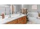 Well-lit bathroom features a double sink, soaking tub and shower at 773 Hathcock Glen Dr, Oakboro, NC 28129