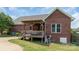The exterior of the home features a deck, pergola, and a stone paver path at 773 Hathcock Glen Dr, Oakboro, NC 28129