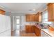 Bright kitchen featuring stainless steel sink and white cabinets at 773 Hathcock Glen Dr, Oakboro, NC 28129