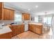 Well-maintained kitchen featuring warm wood cabinetry and laminate countertops, ready for your personal touch at 773 Hathcock Glen Dr, Oakboro, NC 28129