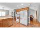 Spacious kitchen features modern appliances and leads to a cozy living area at 773 Hathcock Glen Dr, Oakboro, NC 28129