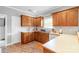 Well-lit kitchen with wooden cabinets, ample counter space, and modern sink at 773 Hathcock Glen Dr, Oakboro, NC 28129