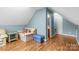 Spacious vaulted ceiling room featuring wood floors and a comfortable seating area at 773 Hathcock Glen Dr, Oakboro, NC 28129