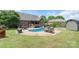 Inviting backyard pool and patio area with outdoor dining and lounging space for relaxation and entertainment at 773 Hathcock Glen Dr, Oakboro, NC 28129