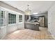 Kitchen featuring stainless steel appliances, granite counters, and abundant natural light at 8701 Holly Creek Ct, Charlotte, NC 28216