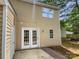 The backyard features a patio area and access to the home through sliding glass doors, perfect for outdoor living and entertaining at 9121 Charminster Ct, Charlotte, NC 28269