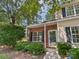 Charming two-story home features a brick facade, complemented by lush landscaping and a welcoming front entrance at 9121 Charminster Ct, Charlotte, NC 28269