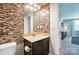 Bathroom features a granite counter, stylish tile backsplash, and modern fixtures at 1006 Spring Rose Ln, Matthews, NC 28104