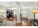 Elegant foyer with hardwood floors, a view into the living spaces, and stylish decor at 1006 Spring Rose Ln, Matthews, NC 28104