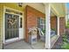 Inviting front porch with decorative flowers and comfortable seating at 1006 Spring Rose Ln, Matthews, NC 28104
