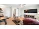 Cozy living room featuring comfortable seating, a ceiling fan, and a television at 1006 Spring Rose Ln, Matthews, NC 28104