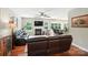 Spacious living room featuring a fireplace, hardwood floors, and an open view to the kitchen at 1006 Spring Rose Ln, Matthews, NC 28104