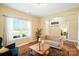 Cozy living room featuring a large window, comfortable seating, and neutral decor at 1006 Spring Rose Ln, Matthews, NC 28104