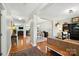 Open-concept living area with hardwood floors, neutral walls, and ample natural light at 1006 Spring Rose Ln, Matthews, NC 28104