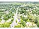 An aerial shot displays neighborhood homes surrounded by lush trees and greenery at 101 Mcalway Rd, Charlotte, NC 28211