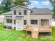 Aerial view of home showcasing a brick exterior, paved driveway, and a two-car garage at 101 Mcalway Rd, Charlotte, NC 28211