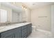 The primary bathroom has dual sinks, granite counters, modern fixtures and a tiled shower at 101 Mcalway Rd, Charlotte, NC 28211