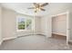 This light-filled bedroom offers a ceiling fan and a window with views of the outdoors at 101 Mcalway Rd, Charlotte, NC 28211