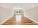 A spacious bonus room with natural lighting featuring hardwood floors with great natural light at 101 Mcalway Rd, Charlotte, NC 28211