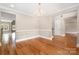 Elegant dining area showcases hardwood floors, a modern chandelier, and views into other living spaces at 101 Mcalway Rd, Charlotte, NC 28211