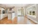 Dining room featuring hardwood flooring and natural light with kitchen in the background at 101 Mcalway Rd, Charlotte, NC 28211