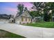 A beautiful two-story home featuring a long drive way and lawn at 101 Mcalway Rd, Charlotte, NC 28211