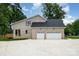 A newly constructed home featuring a spacious two car garage and neutral brick exterior at 101 Mcalway Rd, Charlotte, NC 28211