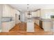 Bright kitchen features stainless steel appliances, an island, and beautiful countertops at 101 Mcalway Rd, Charlotte, NC 28211