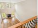 Open living room with hardwood flooring, fireplace, and tall windows at 101 Mcalway Rd, Charlotte, NC 28211