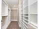 This spacious walk-in closet features built-in shelving and ample storage space for an organized wardrobe at 101 Mcalway Rd, Charlotte, NC 28211