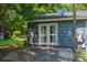 Exterior with a concrete patio, sliding glass doors, grey siding, and brick accents at 108 Graham St, Stanley, NC 28164