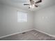 Neutral bedroom with carpeted floors, ceiling fan, and natural light from a window at 108 Graham St, Stanley, NC 28164