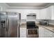 Kitchen with stainless steel appliances, granite countertops, and ample cabinet space at 108 Graham St, Stanley, NC 28164