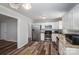 Kitchen features stainless steel appliances, bright cabinets, and wood-look flooring at 108 Graham St, Stanley, NC 28164