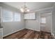 Kitchen features bright white cabinets with stainless steel appliances and wood-look flooring at 108 Graham St, Stanley, NC 28164