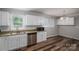 Bright kitchen includes stainless steel appliances, granite countertops, and bright white cabinets at 108 Graham St, Stanley, NC 28164