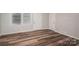 Bright, empty living room showcasing modern hardwood floors and neutral walls, with natural light at 108 Graham St, Stanley, NC 28164